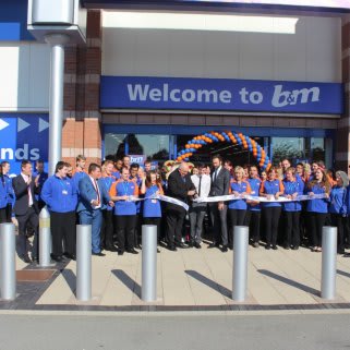 B&M Urmston, Trafford Retail Park is officially opened by the Lord Mayor of Trafford, Councillor John Holder. He is joined by the store team and representatives from Key 103's Cash for Kids charity who received £250 worth of B&M vouchers.