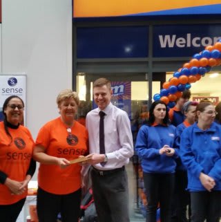 The new Orpington store and representatives from Sense who gratefully accepted £250 worth of B&M vouchers.