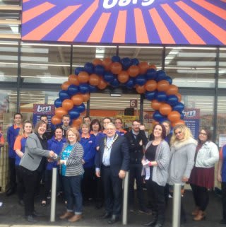 Representatives form Sue Ryder helping to open B&M St Neots