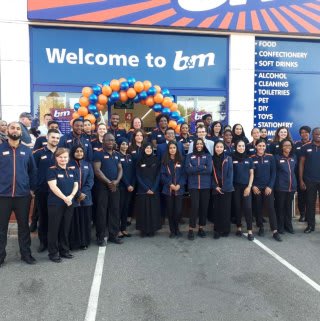 The store team at B&M's newest store in Ilford pose in front of their wonderful new B&M Store, located on Horns Road.