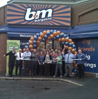 Cynthia Cherry from the Northern Ireland branch of Macmillan Cancer Support cut the ribbon at the opening ceremony of B&M's brand new Cregagh Road, Belfast store.