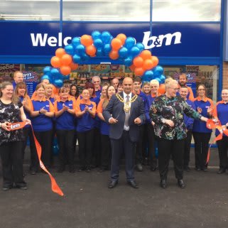 Local Mayor, Councillor Shadab Qumer cuts the ribbon to officially announce B&M's relocated Chadderton store 'open'.