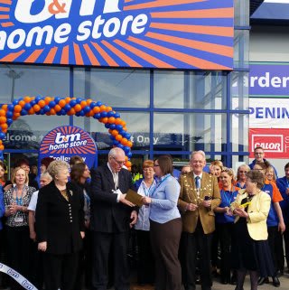 Dunstable store being opened by Councillor Terry Stock and Representatives from the local charity DADDS.