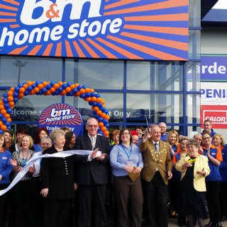 Dunstable store opening and ribbon being cut by Councillor Terry Stock and Representatives from the local charity DADDS.