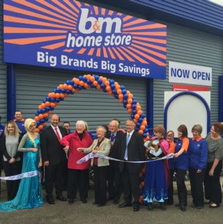 Store manager Andy Cowper-Johnson is joined by Councillor Alison Austin who cut the ribbon with B&M Local Hero Nora Sparling of Butterfly Hospice.