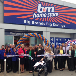 The ribbon being cut at the brand new store in Chester.