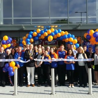 Mayor Derek Brown OBE poses with store staff and representatives from charity Home Start Salisbury, at the opening of B&M's newest store in Salisbury.