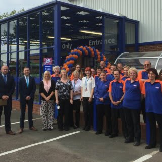 Staff pose outside B&M's new Home Store & Garden Centre in Stratford-Upon-Avon, following the opening ceremony.