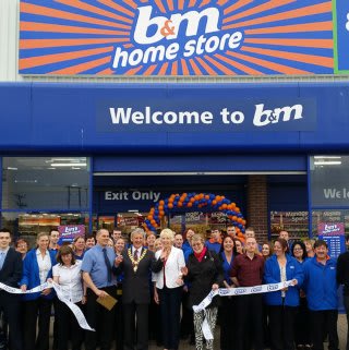 Redruth store being opened by the Chairman of Carn Brae Parish Council – Councillor Bickford and Maggi Lister from the local branch from the RLNI.