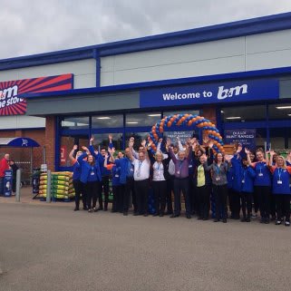 Staff celebrate the opening of the latest B&M store in Towcester