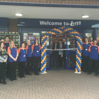 Chairman of East Riding of Yorkshire Council, Councillor Peter Turner cuts the ribbon and officially declares the new B&M Home Store in Willerby, open.