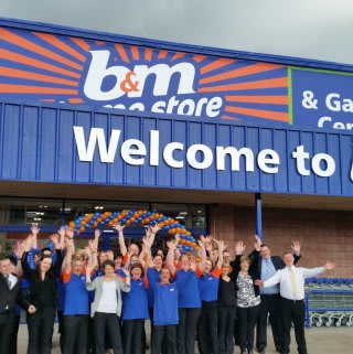 Staff pose outside the new B&M Inverness Home Store & Garden Centre, Telford Retail Park