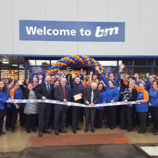 The Hyde store being opened by Pat McCloskey and Peter Wood from the Willow Wood Hospice and gratefully received £250 worth of B&M vouchers.