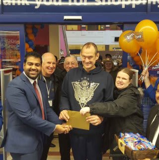 B&M's Local Hero, The Osborne Partnership Charity, gratefully receiving £250 worth of B&M vouchers.
