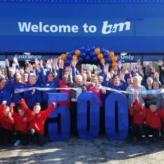 The brand new B&M Mansfield - Baums Lane Home Store & Garden Centre being formally opened by Linda Beard, a representative from the Sue Ryder Charity who has gratefully received £250 worth of B&M vouchers and AC Manor under 12’s