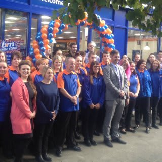 The B&M store team in Gravesend pose in front of their brand new Home Store on New Road.