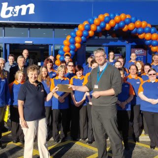B&M's Local Hero for the opening of B&M Penzance, the RNLI Penlee Lifeboats, gratefully receiving £250 worth of B&M vouchers.