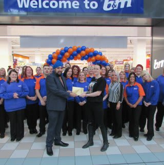 Representatives from Bradley Lowery’s Fight receiving £250 worth of B&M vouchers as a thank you for taking part in the opening of B&M Hartlepool - Middleton Grange.
