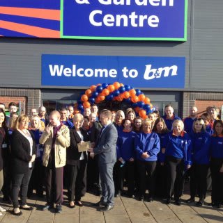 Representatives from Hartlepool Families First gratefully accepting £250 worth of B&M vouchers as a thank you for opening B&M Teesbay