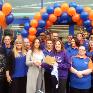 Nicky Fox accepted £250 worth of B&M vouchers on behalf of Forget Me Not Children's Hospice, as a thank you for opening the new Brighouse store.