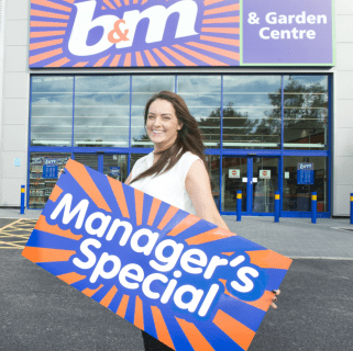 Store manager Kelly Mather poses in front of B&M's brand new Bargains Store & Garden Centre in Brighouse.