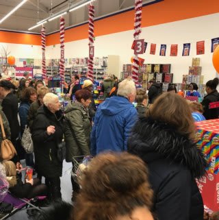 Shoppers queue to pay for their items at B&M's newest store in Dagenham (Merrielands Retail Park).