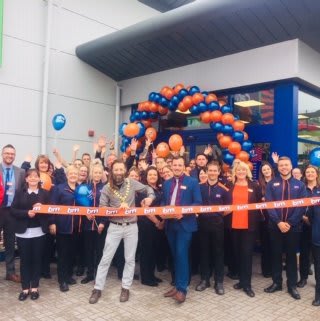 Local mayor, Councillor Tom Kirton cuts the ribbon to officially open at B&M's new store in Chepstow.