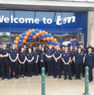The store team at B&M's newest store in Kirkstall pose in front of their wonderful new B&M Store, located on Savins Mill Way