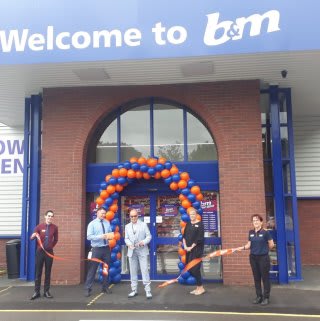 Local Hero Dale Preece-Kelly cuts the ribbon at B&M's new store in Kidderminster. Mr Preece-Kelly received £250 worth of B&M vouchers as a thank you for his hard work in the community.