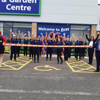 The store team at B&M's newest store in Doncaster pose in front of their wonderful new B&M Store & Garden Centre, located at Lakeside Village Outlet Shopping.