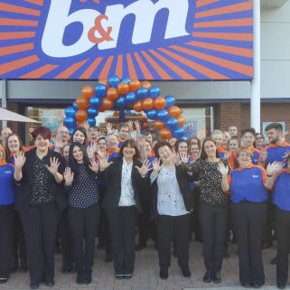 Store staff pose outside their new B&M Congleton store, located at Congleton Retail Park.