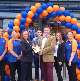 Local charity Simon on the Street gratefully receiving £250 worth of B&M vouchers as a thank you for helping to open the new B&M Armley.