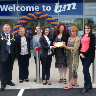 Local Mayor, David Wildey and his wife Denise pose with special guests Strood Community Project. The charity were invited to help open the store and received £250 worth of B&M vouchers as a thank you.