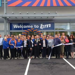 Local Mayor, David Wildey cuts the ribbon to officially declare the new B&M Strood store 'open'.