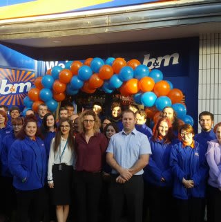 B&M Ashford's store team pose proudly outside their brand new Bargains store on High Street.