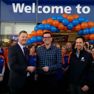 B&M Lauceston's store manager Stuart Handley awards Andy Parsons, representative of local charity South West Lakes Trust, with £250 worth of B&M vouchers.