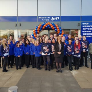B&M Swansea's store team get ready to open the doors to their first customers on opening day.