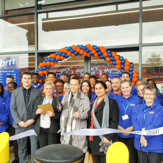 Representatives from Volunteer Centre Lewisham cutting the ribbon at the new B&M Catford