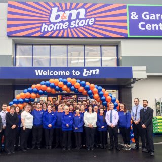 B&M Evesham's store team pose outside of their brand new store on Worcester Road.