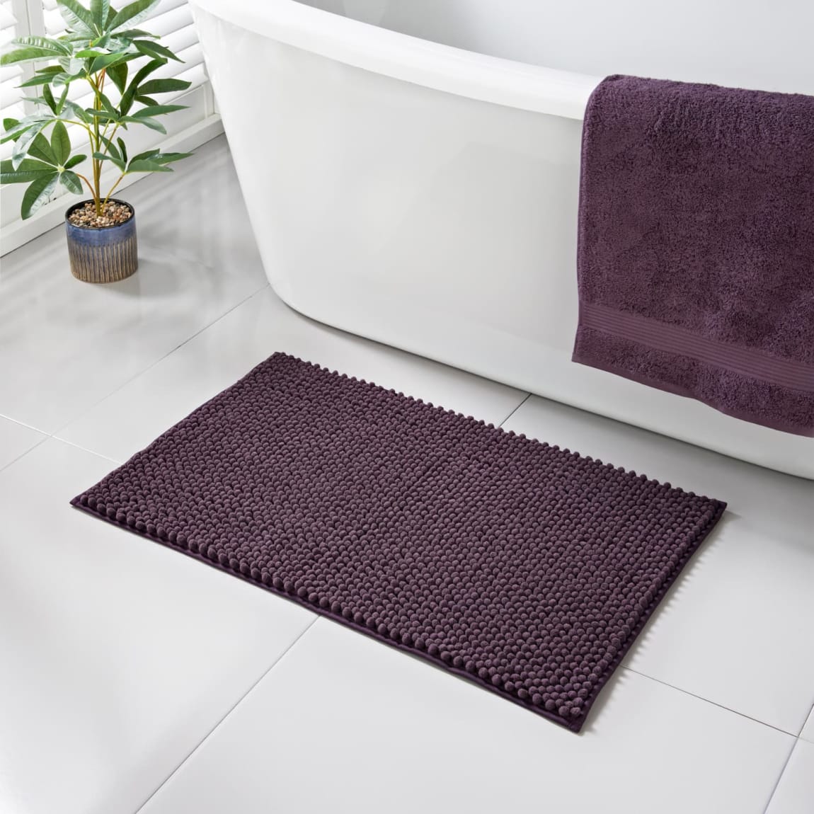431705-signature-noodle-bath-mat-plum
